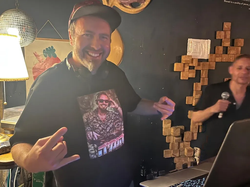 DJ Nimi with headphones in a club