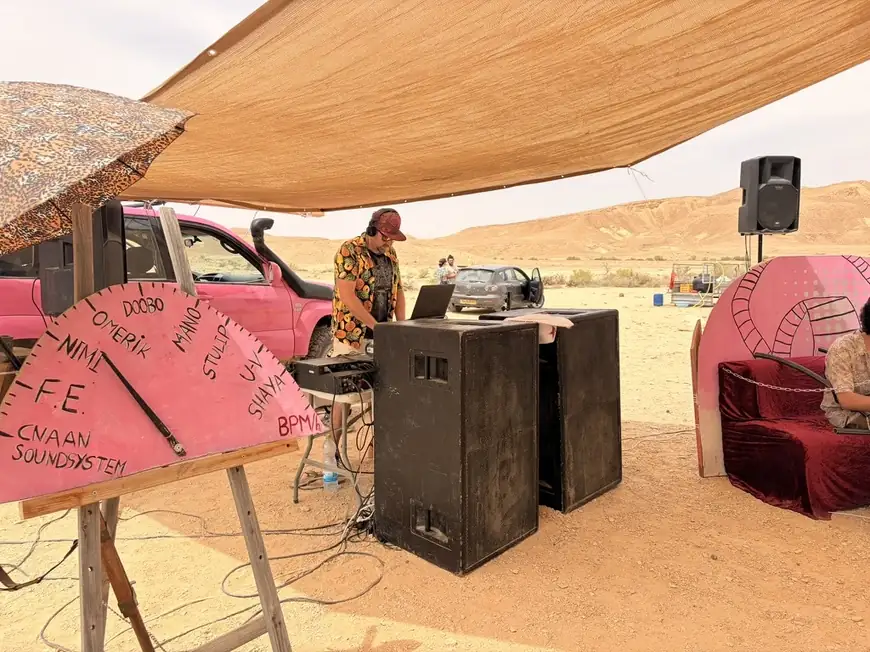 DJ Nimi — Shaded DJ booth in the desert
