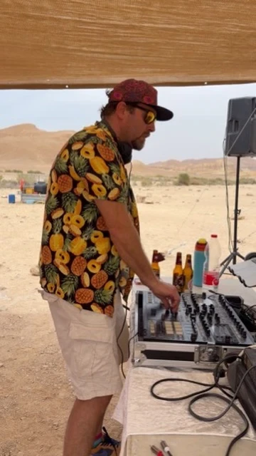 DJ Nimi — Mixing at a desert DJ booth