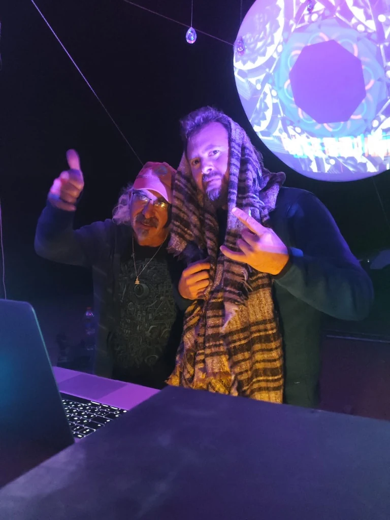 DJ Nimi on stage under purple lighting